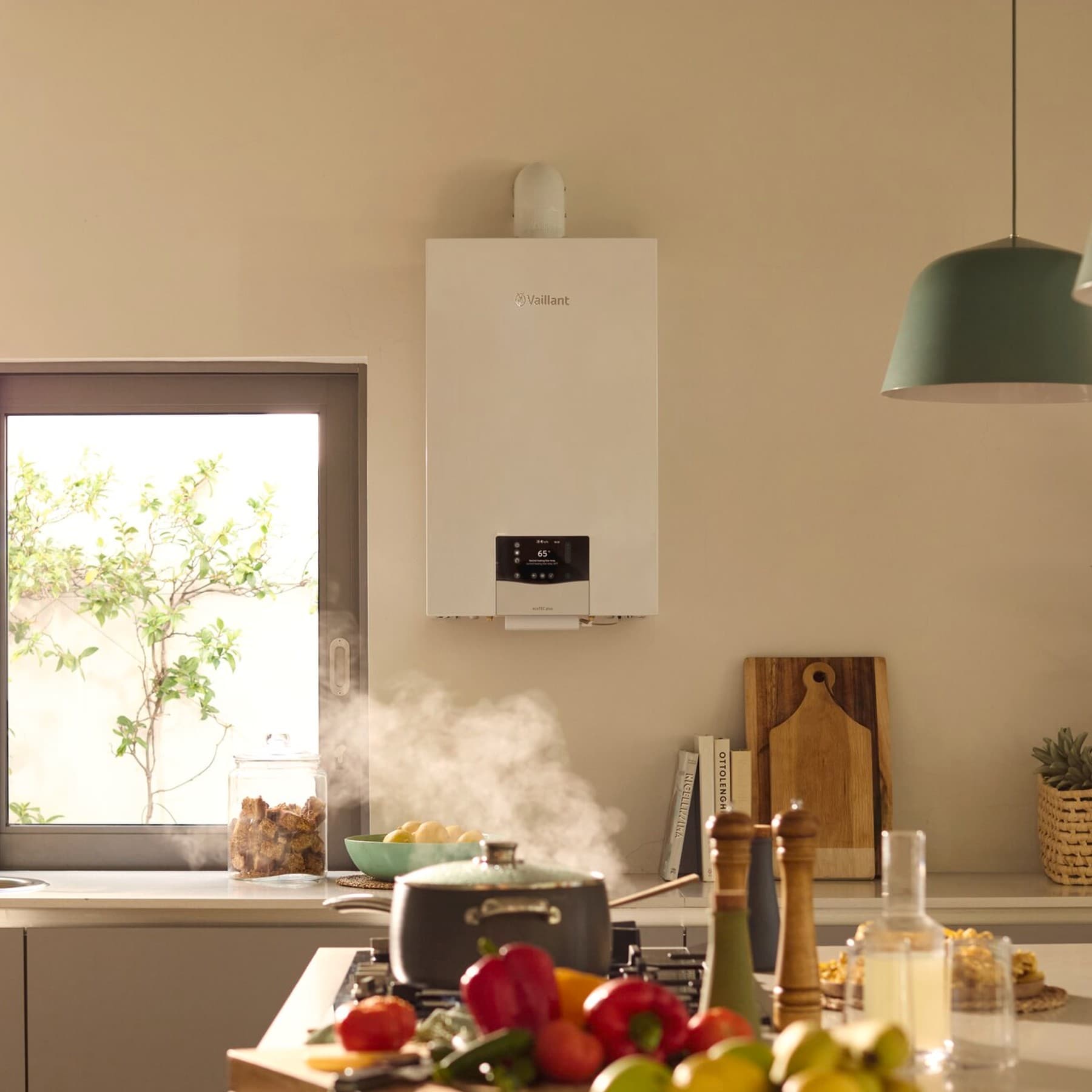 Family cooking together with ecoTEC plus on the wall